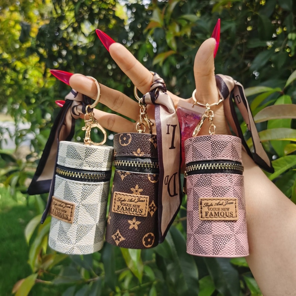Set of three! Shine on! Lip gloss keychain/purse charm. White, Pink & Brown.